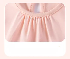 Detailed view of the pink girl dress featuring a round neckline and delicate pleated chest