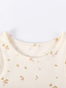 Sleeveless cream floral mesh dress for girls with delicate pink flower print detail
