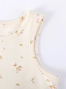 Girl's beige cotton sleeveless floral dress with detailed neckline and mesh accents