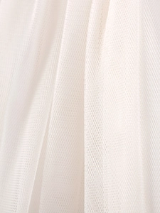 Detailed close-up of soft white tulle mesh fabric for summer girl's tutu princess dress