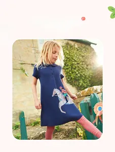 Detail of navy blue polo dress with horse embroidery and pink leggings for girls