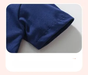 Close-up of navy blue cotton dress sleeve with double-needle stitching detail