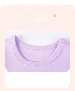 Detailed close-up of the ribbed crew neck design on a purple cotton girls' t-shirt