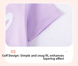 Detailed close-up of lilac cotton T-shirt cuff with clean stitching and heart embroidery