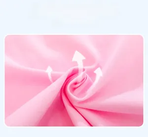 Close-up of soft baby pink cotton fabric with arrows showing high breathability