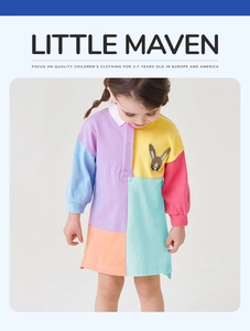 Detail of color-block girl's dress with white polo collar and rabbit embroidery