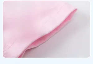 Detail shot of pink cotton children's clothing showing double-needle cuff stitching