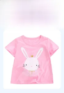Close-up of pink cotton girl's T-shirt featuring a white rabbit print with gold crown