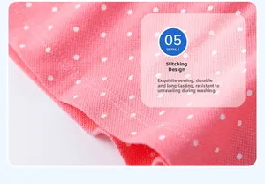 Macro detail of fine double-needle stitching on pink polka dot knit polo dress fabric