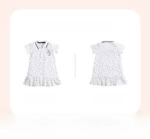 Front and back view of girls' white polka dot polo dress with unicorn embroidery