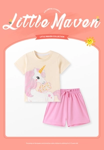 Detail view of cotton summer set featuring unicorn print t-shirt and pink drawstring shorts