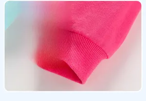 Detail shot of hot pink ribbed knit cuffs on a comfortable cotton girl's dress