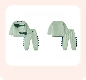Front and back view of green cotton fleece set for boys with crocodile design