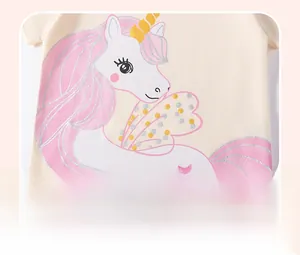 Detail of cotton T-shirt featuring a unicorn print with gold sequins and glitter wings