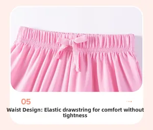 Detail of pink cotton girl's shorts with elastic waistband and drawstring design