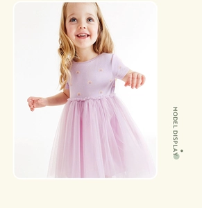 Detail of girls purple dress featuring rainbow print and fluffy tiered mesh skirt