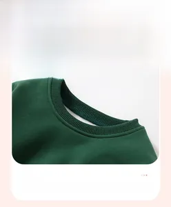 Detail of dark green sweatshirt featuring elastic ribbed neckline and reinforced stitching
