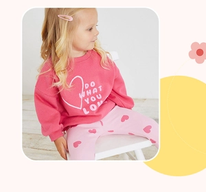 Detail of girls cotton hoodie set with 'DO WHAT YOU LOVE' print and heart pattern pants