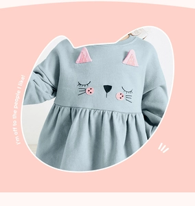 Detail of light blue girls' sweatshirt with 3D cat ears and cute embroidered whiskers