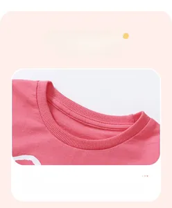 Detail view of pink cotton sweatshirt neckline with soft ribbed knit texture