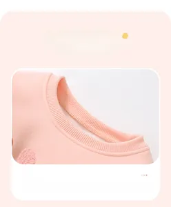 Detailed view of the pink knit sweatshirt neckline featuring ribbed elastic trim stitching