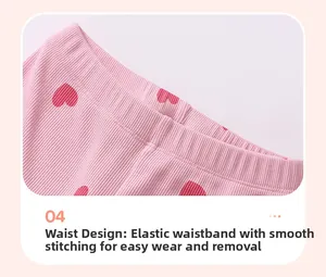 Detail view of pink ribbed cotton knit pants featuring an elastic waist and red hearts