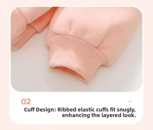 Detail of pink fleece sweatshirt featuring ribbed elastic cuffs and thick knit cotton texture