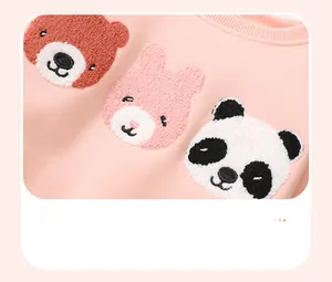 Detail of cute animal towel embroidery with bear, rabbit, and panda on pink sweatshirt