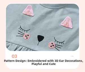 Detail of baby girl hoodie featuring a 3D cat ear design and fine embroidery on green fabric