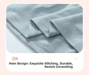 Detail of double-needle stitching on the hemline of a mint green cotton girls' outfit