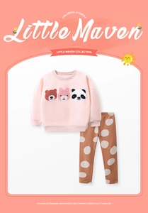 Detail of pink fleece sweatshirt with animal patches and brown polka dot pants for girls