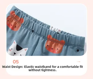 Detail of elastic waistband on blue-grey toddler pants with cute animal patterns