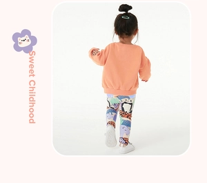 Back view of girl in peach sweatshirt and animal print leggings sweet childhood outfit