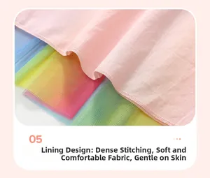 Dettaglio dell'abito da bambina con fodera in cotone rosa e gonna in tulle arcobaleno
