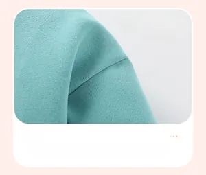 Detail of precise stitching and durable knit texture on mint green children sweatshirt