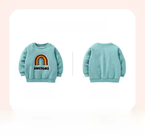 Detail of mint green kids sweatshirt with colorful rainbow patch and AWESOME embroidery