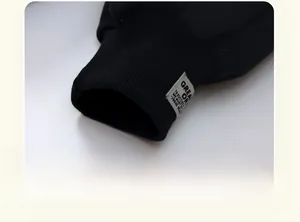 Macro detail of ribbed ankle cuffs and woven tag on thick winter boys' joggers