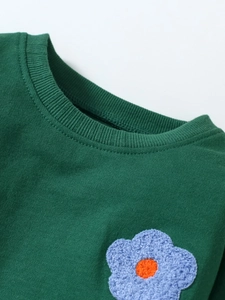 Girl's dark green fleece sweatshirt with blue floral applique and ribbed crew neck