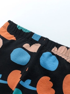 Girls winter fleece tracksuit pants with colorful floral patterns and elastic waist