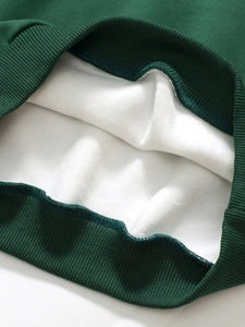 Girls dark green fleece-lined sweatshirt set showing thick ribbed cuffs and warm lining