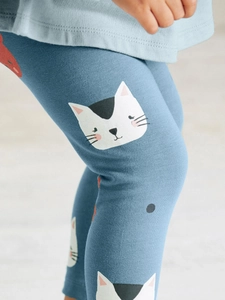 Blue knit leggings for toddler girls featuring cute white and black cat prints