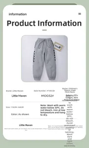 Detail view of boys' grey winter fleece trousers featuring drawstring waist and side patterns