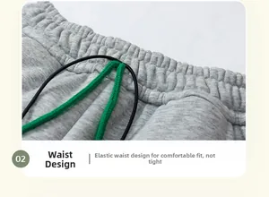 Elastic waistband detail of gray thick winter pants with contrasting green drawstrings
