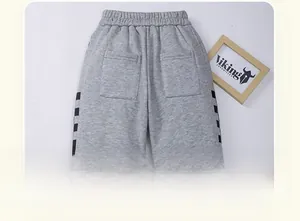 Detail of children's fleece grey jogger pants with elastic waistband and back pockets