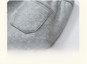 Detail view of precise stitching and reinforced pocket seams on kids warm grey knit pants
