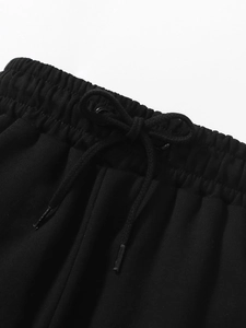 Boys black cotton cargo pants with elastic waistband and adjustable drawstring tie