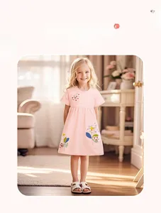 Detail of pink cotton girl's dress featuring colorful butterfly and floral embroidery