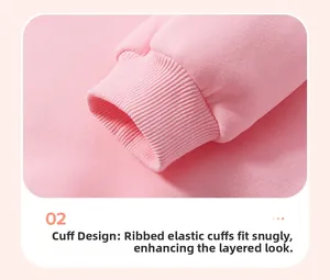 Close-up of pink girls sweater featuring elastic ribbed cuffs and soft cotton texture
