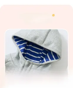 Detail of grey hooded sweatshirt for boys featuring blue striped lining and button closure