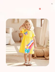 Detail of yellow cotton dress for girls featuring rainbow, sunflower and butterfly prints